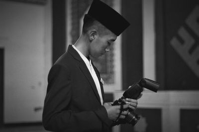 Teenager with camera in his sight