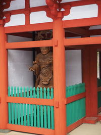 Low angle view of statue against building