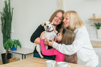 Portrait of girl with teddy bear at home