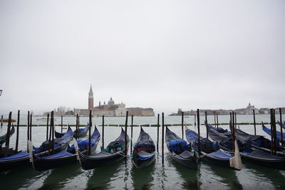 Boats moored at dock