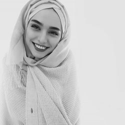 Portrait of a smiling young woman in snow