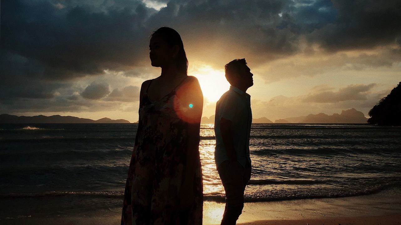 SILHOUETTE PEOPLE AT BEACH DURING SUNSET