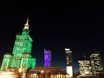 Low angle view of illuminated city at night