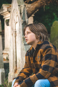 Side view of young man looking away