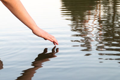 Midsection of woman in lake