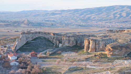 Aerial view of landscape with mountain range in the background