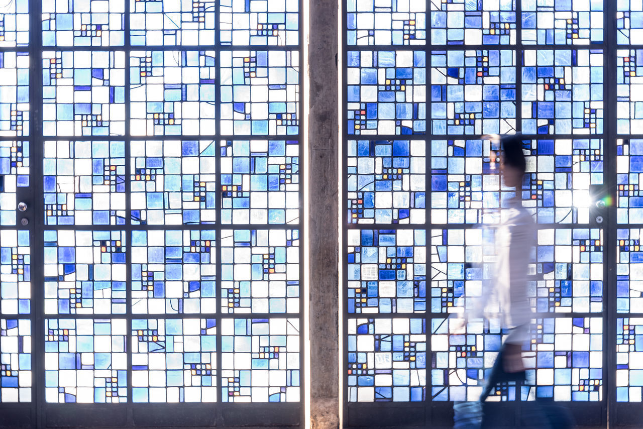 WOMAN WALKING IN BUILDING