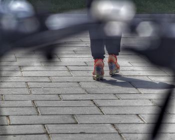 Low section of woman on road