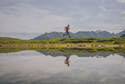 Young male trail running through at the alps, chamonix, france.