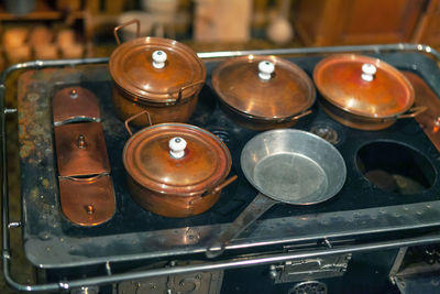 High angle view of old tea light candles in temple