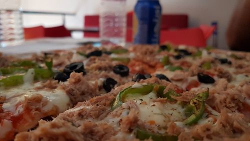 Close-up of pizza served on table