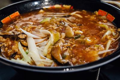 Close-up of ramen noodles in cooking pan