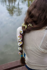 Rear view of woman wearing flowers in hair