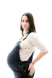 Portrait of beautiful young woman against white background