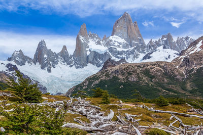 Scenic view of mountains against cloudy sky