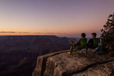 Two men looking at grand canyon