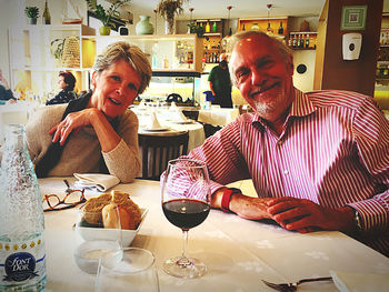 Man and woman standing at restaurant table