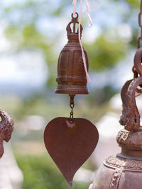 Close-up of bell hanging against temple