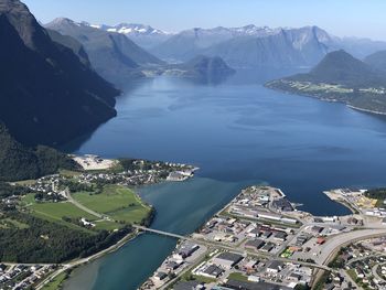 High angle view of buildings by sea