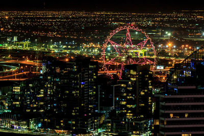 Illuminated buildings in city at night
