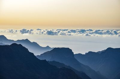 Scenic view of mountains against sky during sunset