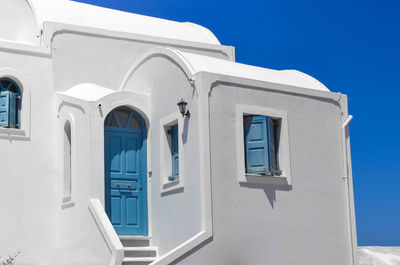 Low angle view of building against blue sky