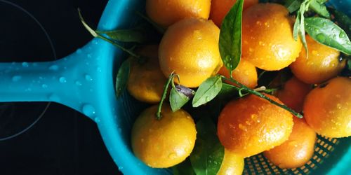 Close-up of oranges in container