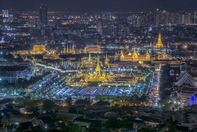 High angle view of illuminated city buildings at night