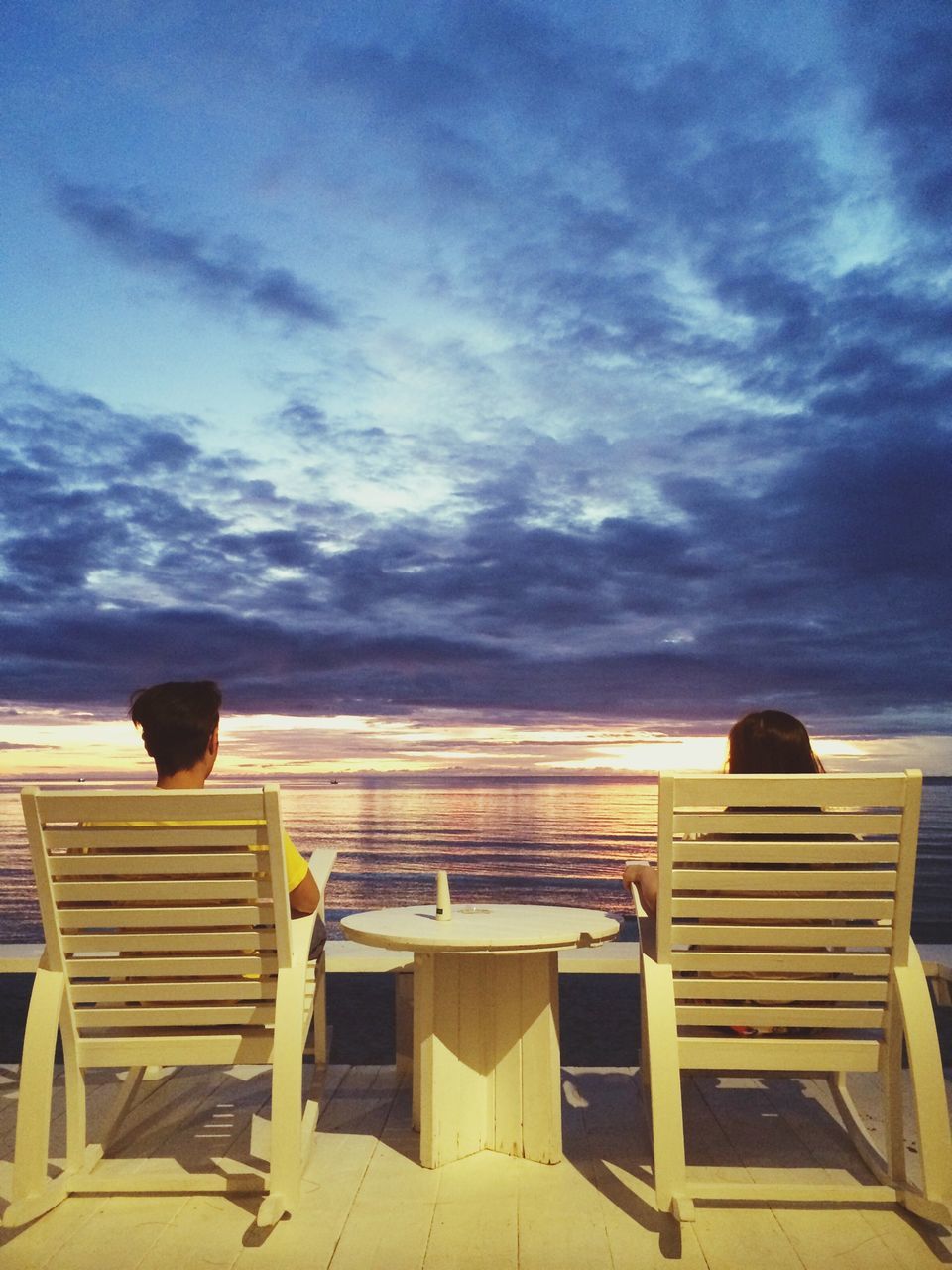 sky, cloud - sky, tranquil scene, sea, cloud, tranquility, cloudy, scenics, sunset, built structure, beauty in nature, nature, horizon over water, chair, architecture, idyllic, wood - material, empty, outdoors, blue