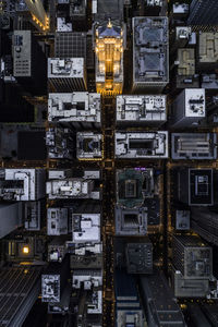 High angle view of illuminated buildings in city at night