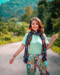 Portrait of a smiling young woman standing outdoors