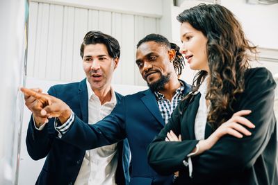 Business colleagues stacking hands