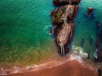 High angle view of rocks in sea