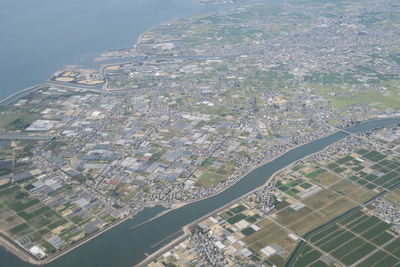 High angle view of buildings in city against sky