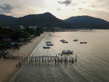 High angle view of beach by buildings against sky