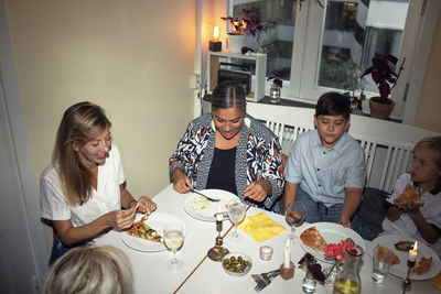 Family having meal at table