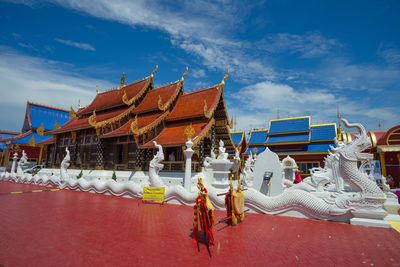 Panoramic view of temple against building