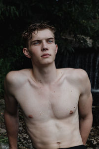 Portrait of young man standing outdoors