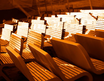 High angle view of empty chairs in stadium