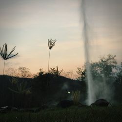 Scenic view of landscape against sky at sunset