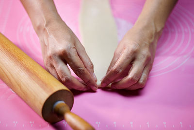 Cropped hands of woman with nail polish