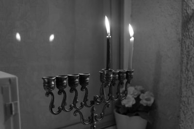 Close-up of illuminated candles at home