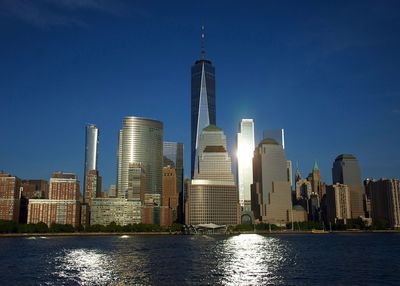 Modern buildings in city against clear sky