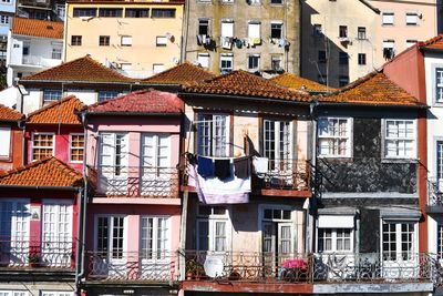 Houses against buildings in city