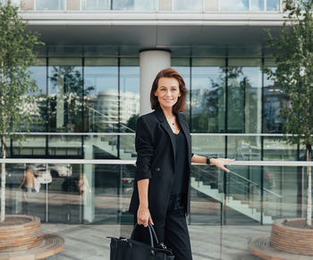 Portrait of young businesswoman standing in office