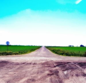 Road passing through field