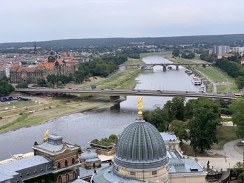 High angle view of buildings and bridge in city