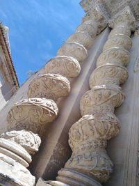 Low angle view of statue against building