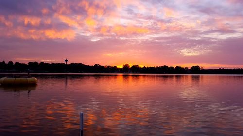Scenic view of lake at sunset