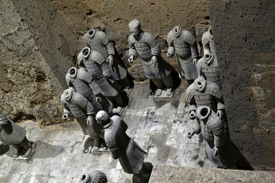 High angle view of statues on wall